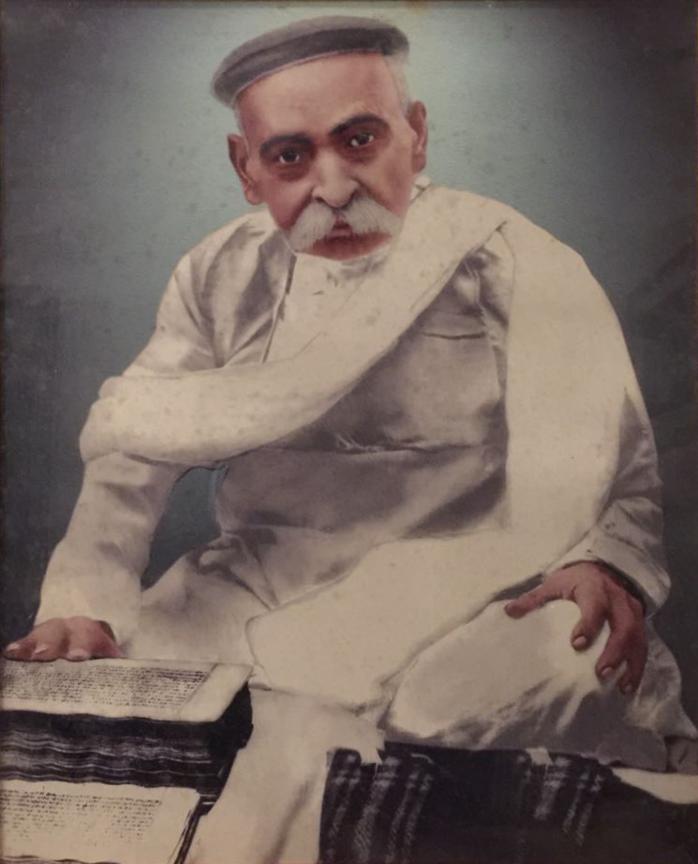 Tulsi Ram (1838 - 1890), great grandson of Raja Harsukh Rai, reading Jain manuscripts